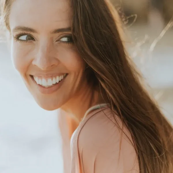 Close-up of a person with a flawless, bright Hollywood Smile after cosmetic dental treatment.