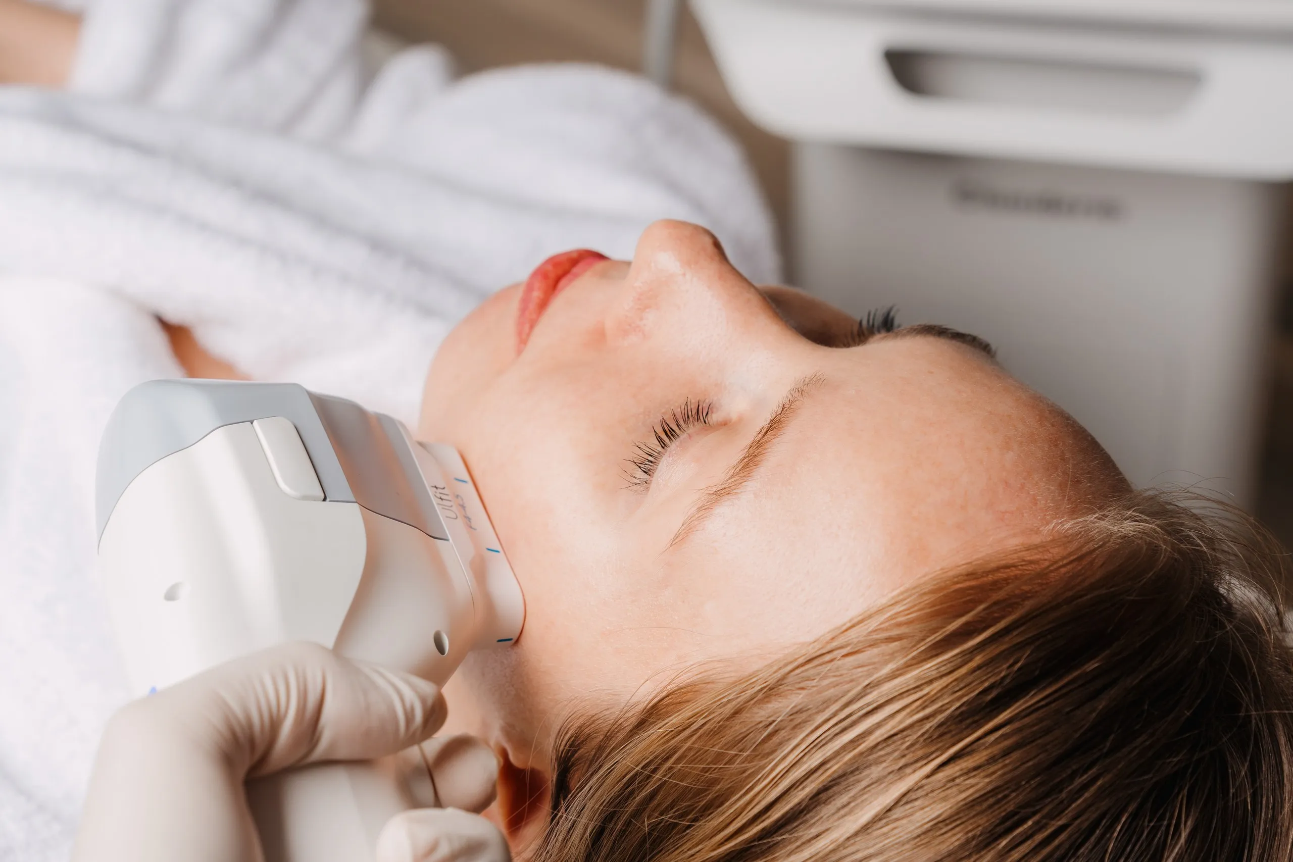 Image of a person undergoing HIFU treatment at a clinic in Dubai, showcasing before and after results