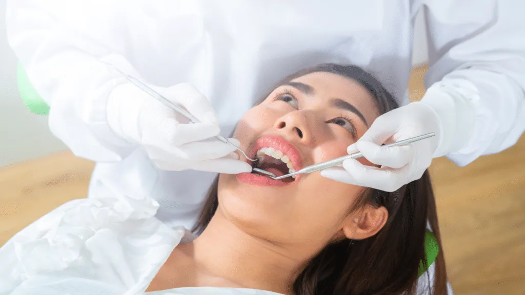 A patient smiling confidently with natural looking dentures.