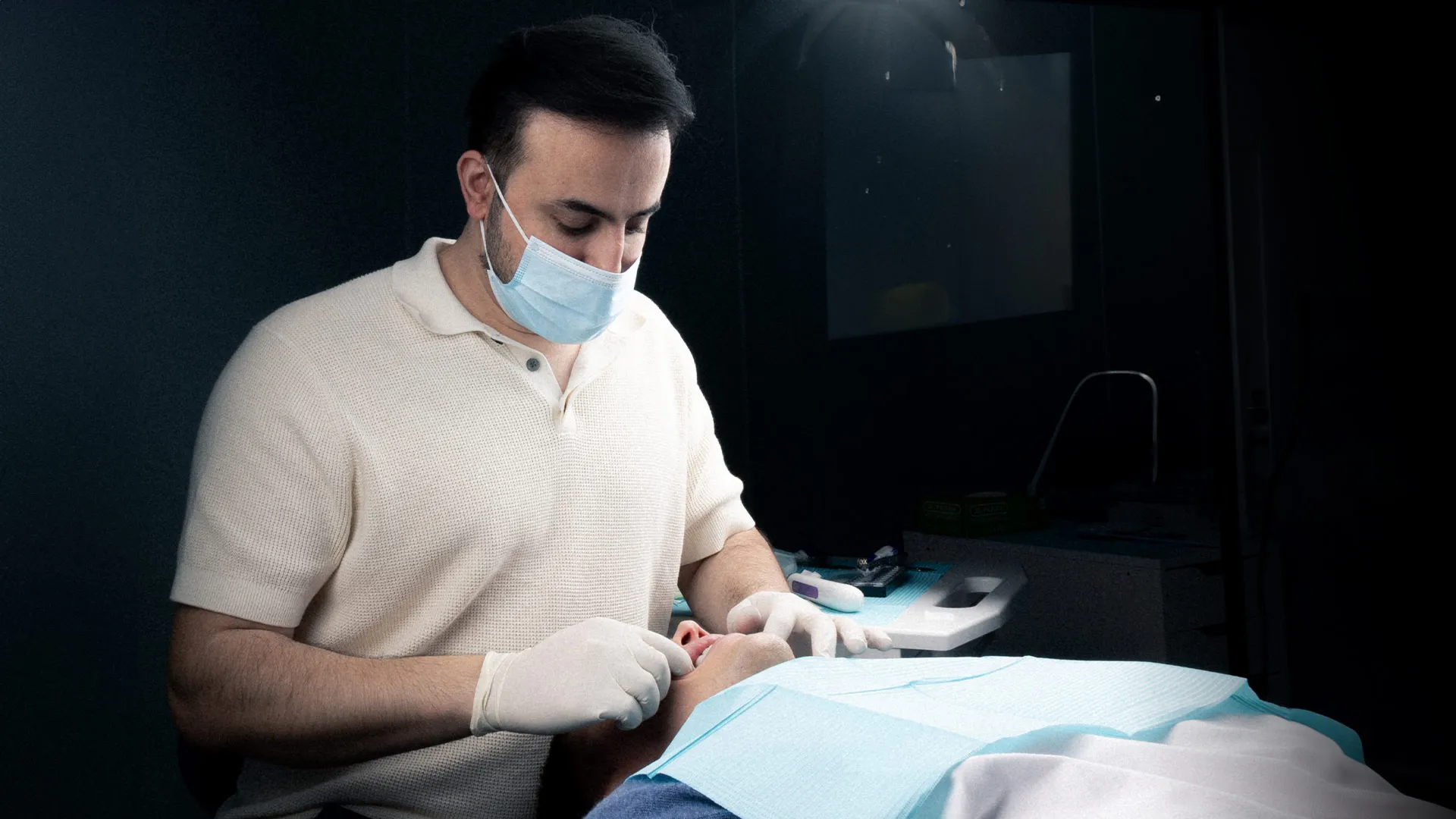 Doctor performing a Hollywood smile treatment on a patient in Dubai.